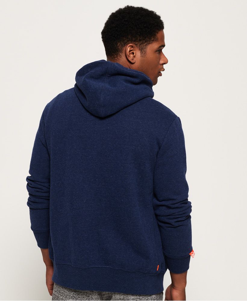 Superdry men’s zip hoodie from the Orange Label range. This hoodie is great for layering this season, it features the iconic Superdry logo embroidered on the chest, two front pockets and a drawstring hood. This hoodie has been finished with a Superdry tab on the cuff, ribbed hem and cuffs for a flattering fit and an orange tab in the seam.