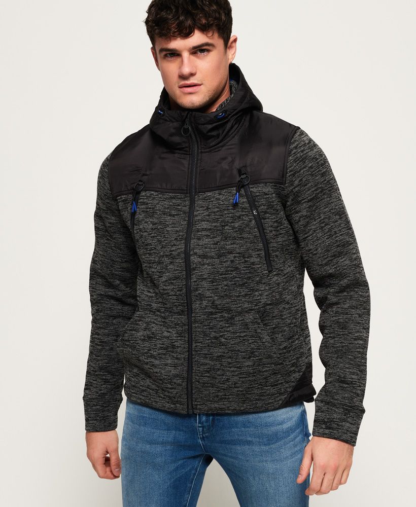 Superdry men’s Mountain zip hoodie. Inspired by Mountaineering gear, this hybrid zip hoodie features a bungee cord adjustable hood, four front pockets and a bungee cord adjustable hem. The Mountain zip hoodie also features a branded placket and an applique Superdry Mountain badge on the sleeve. The zip hoodie is finished with an embroidered Superdry logo on the shoulder.