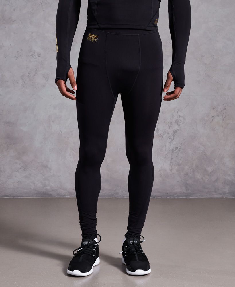 Superdry men’s Performance compression leggings. Take your training routine to the next level with these high quality Performance compression leggings. Designed with moisture wicking, quick dry fabric and flatlock seams to provide strength and comfort. These compression leggings shape to your body to provide athletic recovery. The Performance compression leggings feature a reflective Superdry logo detailing on the hip and down one leg, an elasticated waistband and a back pocket.