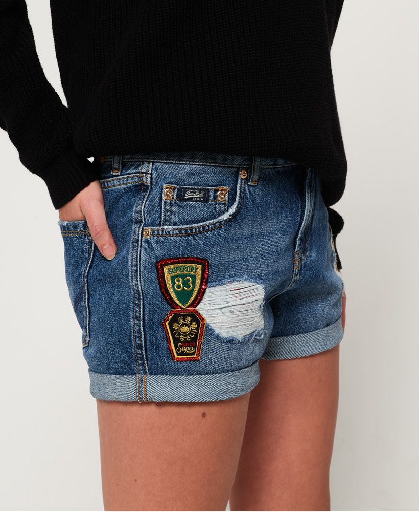 Superdry women's Steph boyfriend shorts. Raise the style status with this pair of boyfriend fit denim shorts. They feature distressed detailing, turned up hems, five pockets and zip and button fastening. The Steph boyfriend denim shorts are finished with a Superdry logo patch on the coin pocket, an embossed logo patch on the rear waistband and belt loops.