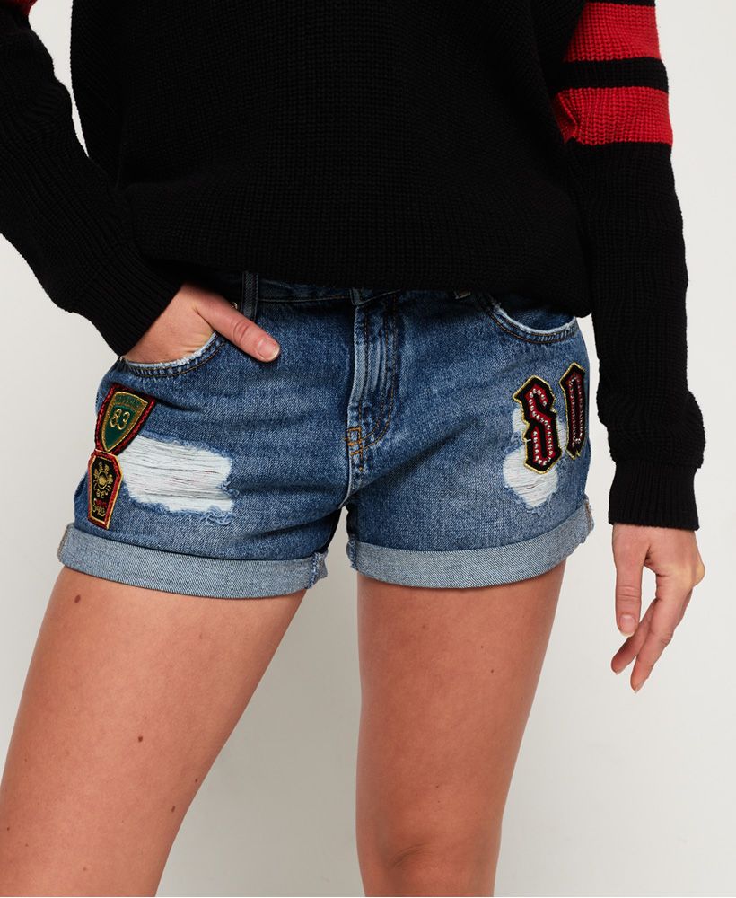 Superdry women's Steph boyfriend shorts. Raise the style status with this pair of boyfriend fit denim shorts. They feature distressed detailing, turned up hems, five pockets and zip and button fastening. The Steph boyfriend denim shorts are finished with a Superdry logo patch on the coin pocket, an embossed logo patch on the rear waistband and belt loops.