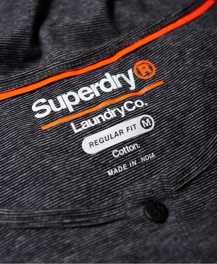 Superdry men's SD Laundry organic cotton grandad top. This luxuriously soft top is perfect for lounging in, featuring a button down fastening and long sleeves. This grandad top is completed with a Superdry logo patch above the hem. Wear with a pair of our super soft joggers for the ultimate comfortable attire.Made using cotton grown using organic farming methods which minimise water usage and eliminate pesticides, maximising soil health and farmer livelihoods.
