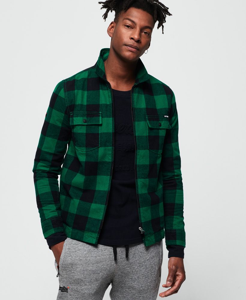 Superdry men's Rookie Harrington shirt. This thick cotton shirt is the perfect layering piece for this season and features a zip fastening, two buttoned chest pockets and button fastened cuffs. The Rookie Harrington shirt is completed with a Superdry logo patch on the pocket. This versatile shirt would look great unzipped over a simple t-shirt.