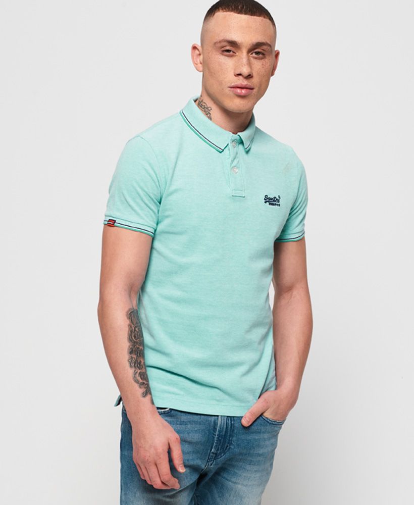 Superdry men's Classic Poolside pique polo shirt. This pique polo shirt features double button fastening, split side seams and an embroidered version of the Superdry logo on the chest. Finished with a logo tab on the hem and stripe detailing around the collar and cuffs, style this polo with a pair of chinos for a great smart yet casual outfit.Made with Organic Cotton - Made using cotton grown using organic farming methods which minimise water usage and eliminate pesticides, maximising soil health and farmer livelihoods.Slim fit
