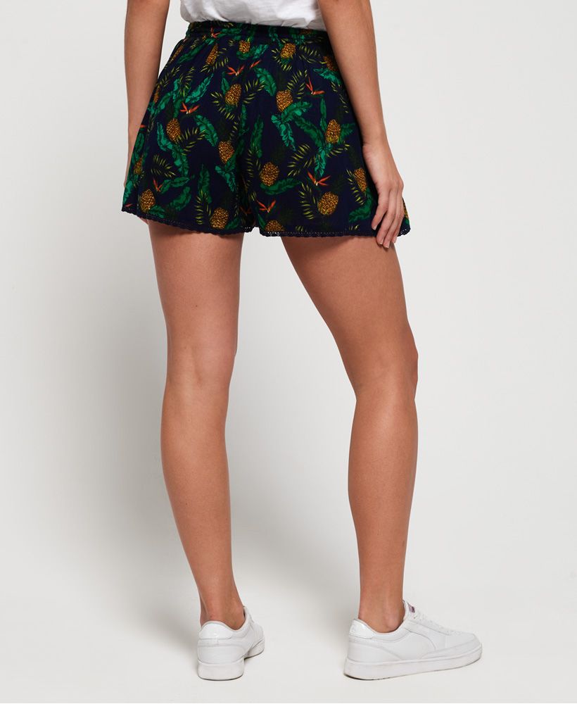 Superdry women's Dylan beach shorts. These lightweight, loose fit shorts are the perfect addition to your summer wardrobe. Boasting an elasticated waistband, delicate lace detailing on the hem and a subtle logo badge on the leg, the floaty style of these shorts make them a great foundation for an easy, relaxed, daytime outfit.