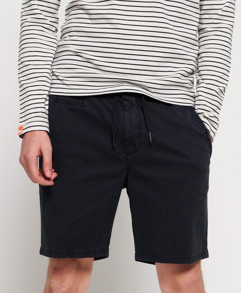 Superdry men's Sunscorched shorts. These shorts are perfect for the warmer months, featuring a classic five pocket design, main button and zip fastening and drawstring waist fastening. Finished with a Superdry logo tab on one pocket and a Superdry logo badge on the back.
