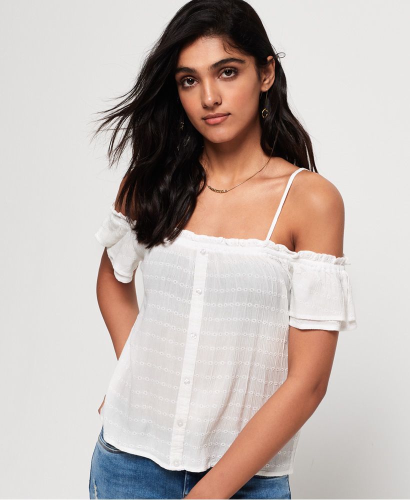 Superdry women's Lea peekaboo top. A great lightweight top for warmer weather, the Lea peekaboo top features off the shoulder sleeves with adjustable spaghetti straps and button fastening down the front. The top is completed with a small metal logo badge on the hem. Style with a denim mini or cut off shorts.