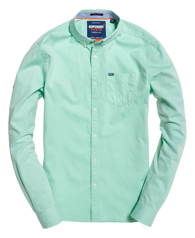 Superdry men's Premium University Oxford shirt. Clean, crisp and classic, our Premium University Oxford shirt is sure to help you make an impression. Featuring a button down fastening, button collar and chest pocket, this shirt will keep you looking sharp whatever the occasion. The shirt also features button cuffs and subtle logo tab on the pocket. Completed with a logo badge on one sleeve and logo detailing in the split side seam, this shirt will work well with chinos for the office or with a pair of slim jeans for dinner.