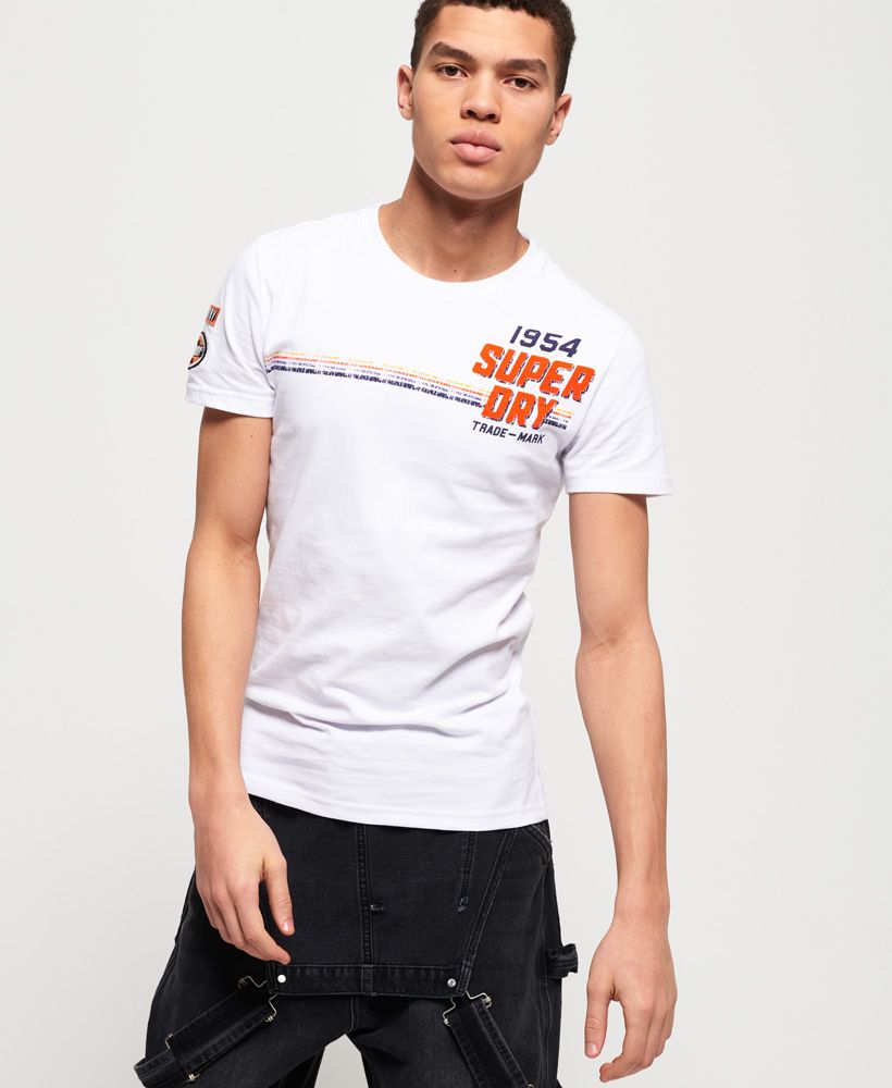 Superdry men's Custom Classics t-shirt. Breathe life into your t-shirt collection this season with the Custom Classic t-shirt. This crew neck t-shirt features short sleeves and a large logo graphic on the chest. Completed with logo badges on one sleeve, pair with slim jeans and your favourite trainers.