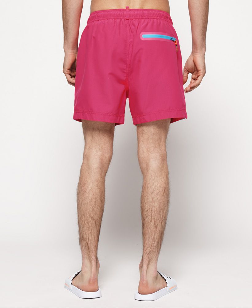 Superdry men's Beach Volley swim shorts. Hit the beach in style this season with the Beach Volley swim shorts, featuring an adjustable drawstring waistband, two front pockets and a zipped back pocket. These shorts also feature a mesh insert and are completed with an embroidered version of the logo on the leg.Please note due to hygiene reasons, we are unable to offer an exchange or refund on swimwear, unless they are sealed in their original packaging. This does not affect your statutory rights.