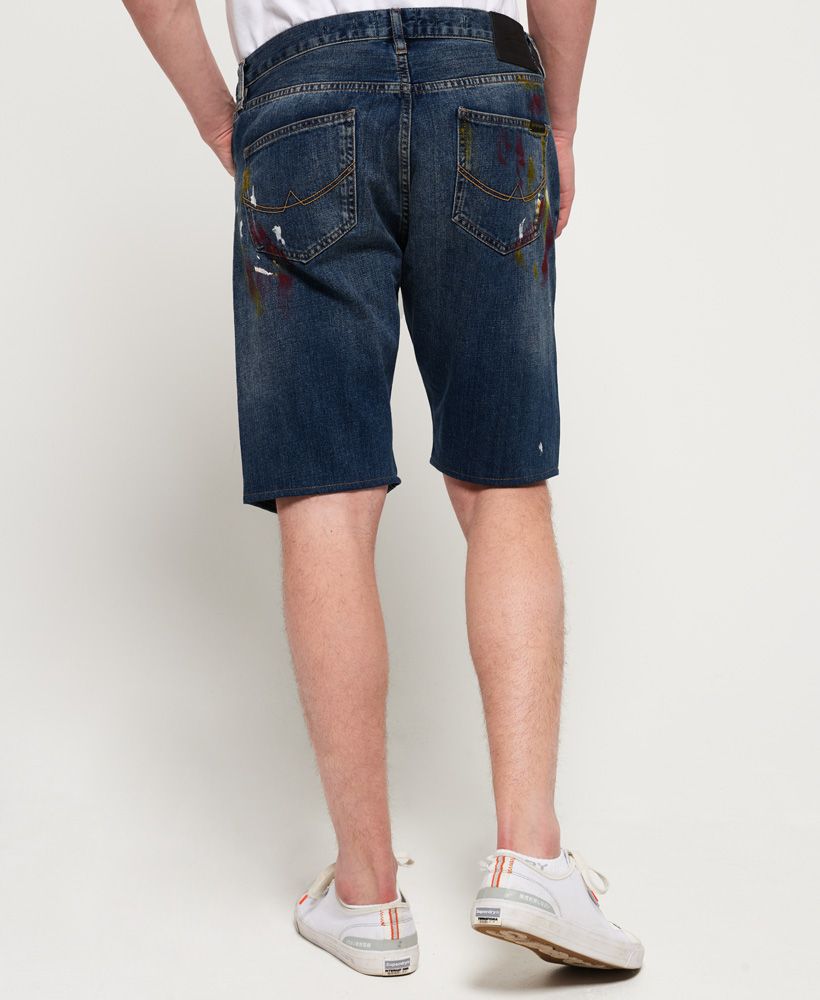 Superdry men's tapered shorts. This classic pair of denim shorts feature a five pocket design, belt loops and a button fly fastening. The shorts have been completed with a leather logo patch on the rear of the waistband and embroidered logo on the coin pocket. Style these shorts with a button down shirt and trainers for smart casual vibes.