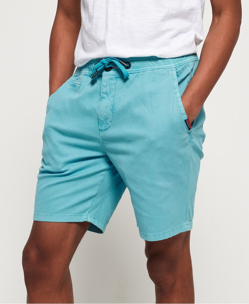 Superdry men's Sunscorched shorts. These shorts are perfect for the warmer months, featuring a classic five pocket design, main button and zip fastening and drawstring waist fastening. Finished with a Superdry logo tab on one pocket and a Superdry logo badge on the back.