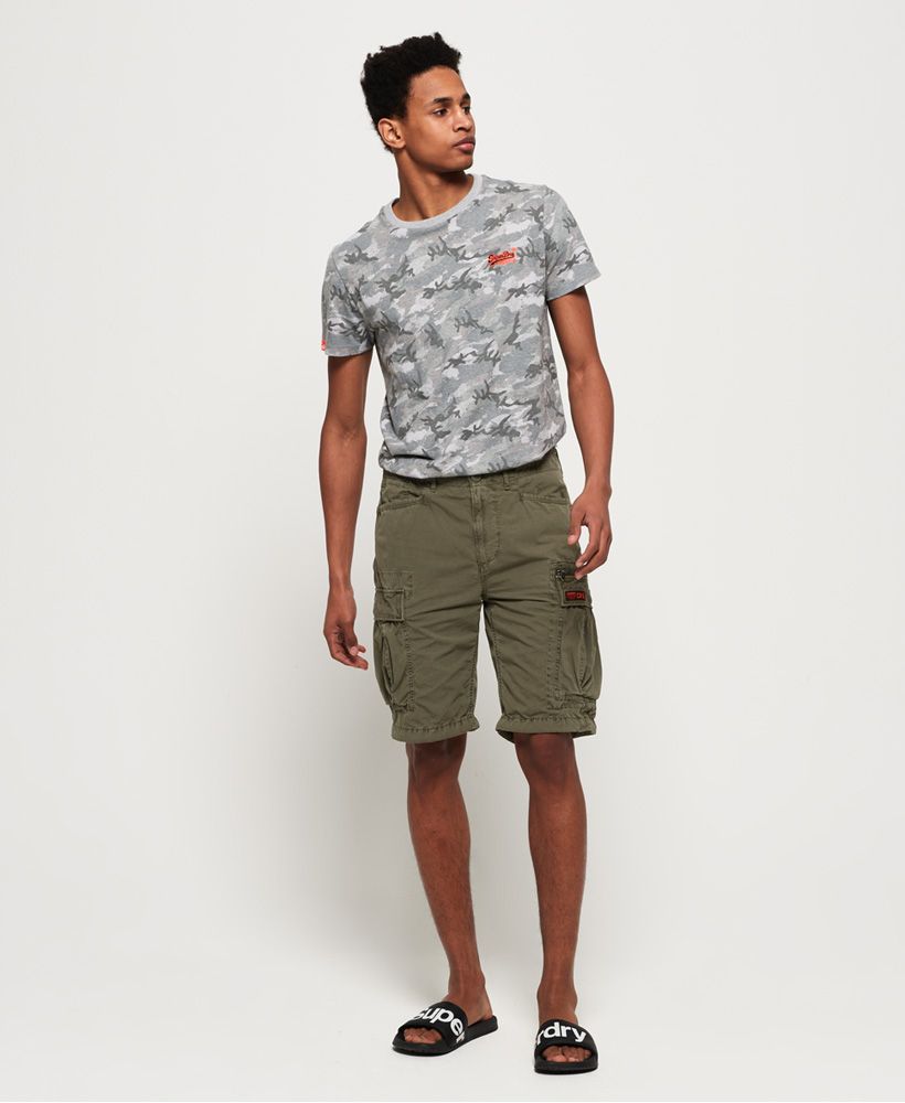 Superdry men's Parachute cargo shorts. This is the perfect choice for a fresh and current wardrobe, featuring a seven pocket design, a main zip and button fastening and a variety of military inspired badges. Finished with a Superdry logo badge on the back and one on a front pocket.