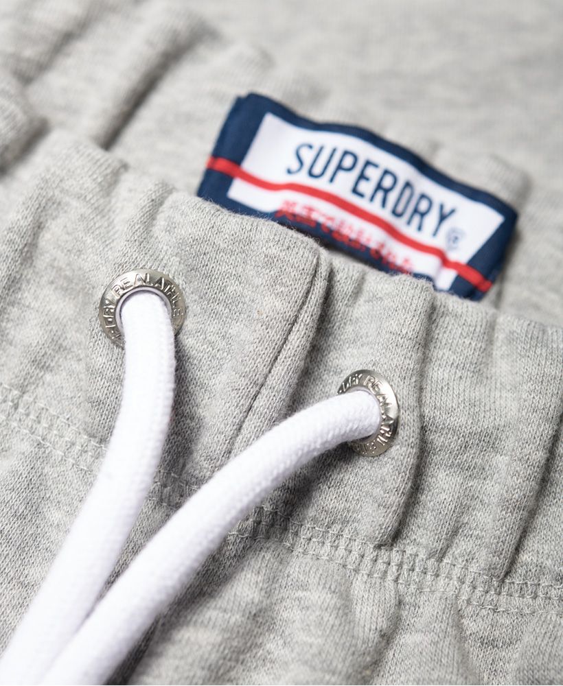 Superdry women's Alicia joggers. These joggers feature a drawstring adjustable waist, a soft fleece lining, two front pockets and elasticated cuffs. Finished with Superdry logo detailing down the sides.Relaxed fit