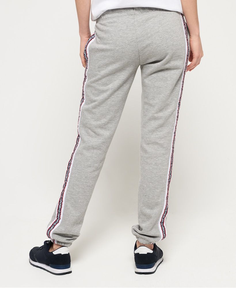 Superdry women's Alicia joggers. These joggers feature a drawstring adjustable waist, a soft fleece lining, two front pockets and elasticated cuffs. Finished with Superdry logo detailing down the sides.Relaxed fit