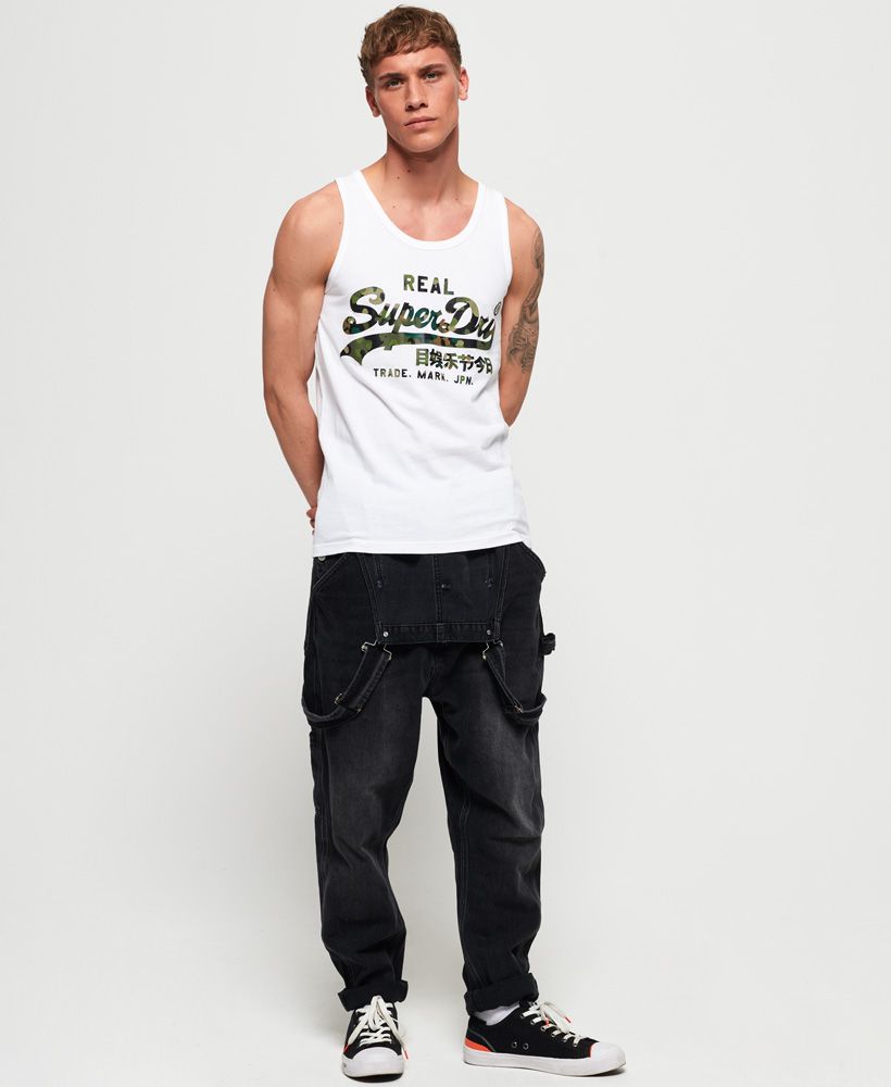 Superdry men's Vintage Logo layered camo lite vest top. This classic vest top features a camo effect logo design on the chest and will be the perfect partner to shorts and trainers this season.