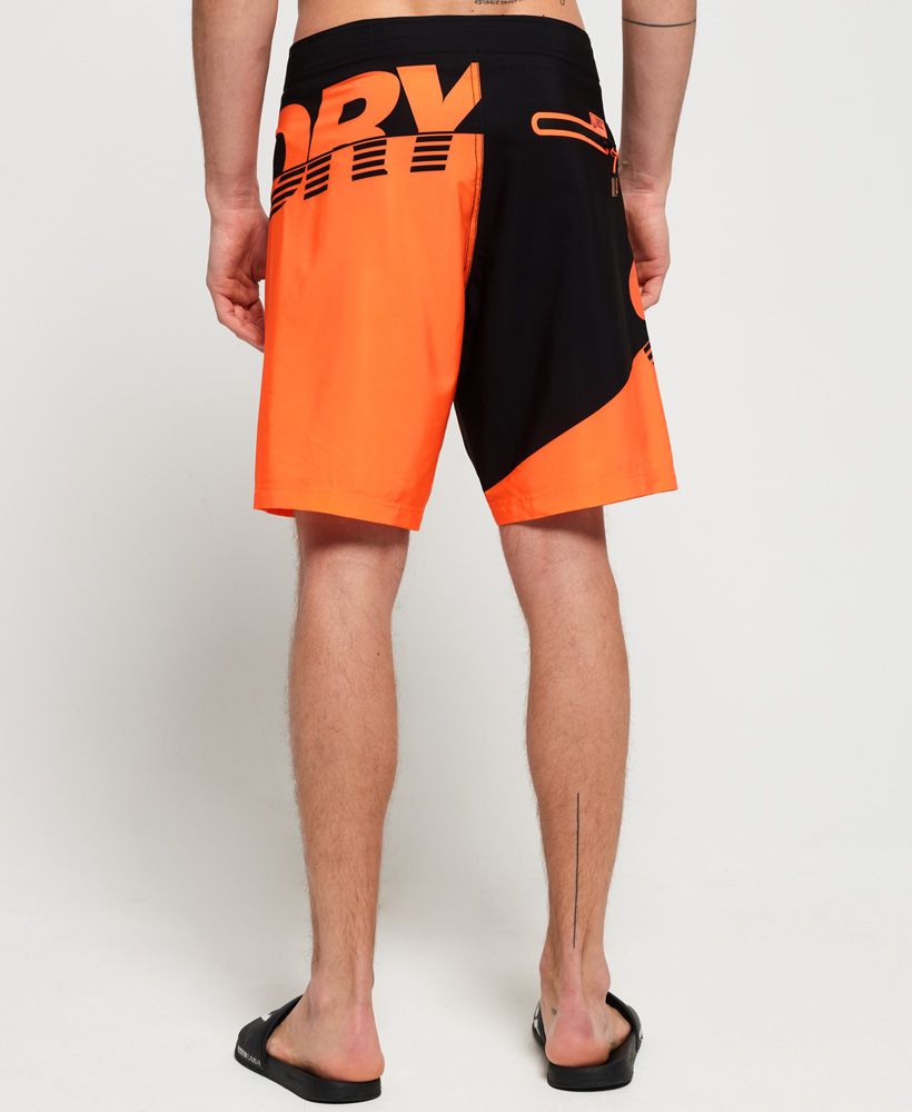 Superdry men's Hydro boardshorts. These swim shorts feature a hook and loop and lace fastening, zipped back pocket and logo tab on the waistband. The Hydro boardshorts are completed with a logo badge on the leg.Please note due to hygiene reasons, we are unable to offer an exchange or refund on swimwear, unless they are sealed in their original packaging. This does not affect your statutory rights.