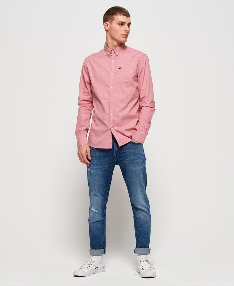 Superdry men's Premium Shoreditch shirt. This classic long sleeve shirt features a button fastening and button down collar, pocket on the chest and button cuffs. Finished with a logo tab on the pocket and logo badge on one sleeve, pair with slim jeans to complete your look.
