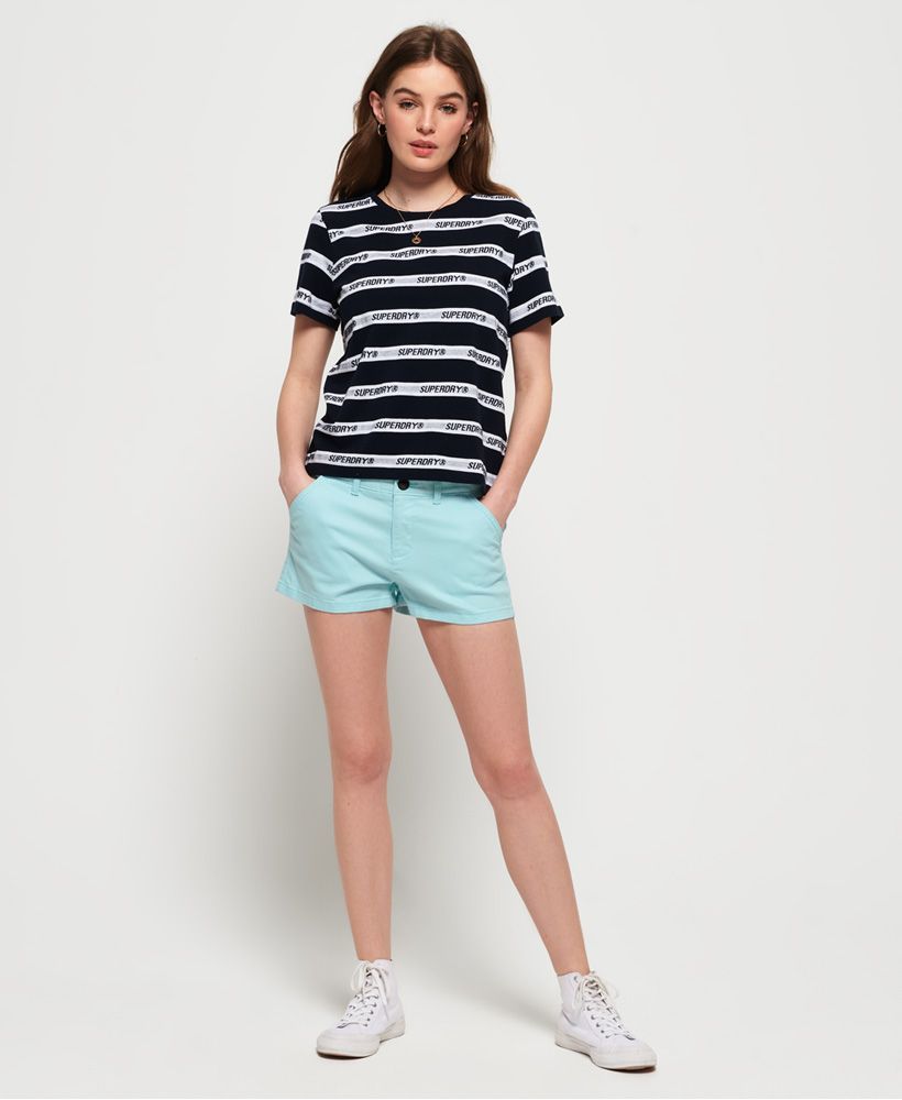 Superdry women's Chino hot shorts. These chino shorts are a perfect addition to your summer wardrobe, featuring a classic four pocket design and zip and button fastening.Completed with a Superdry metal badge on the front and a Superdry logo badge above one back pocket.
