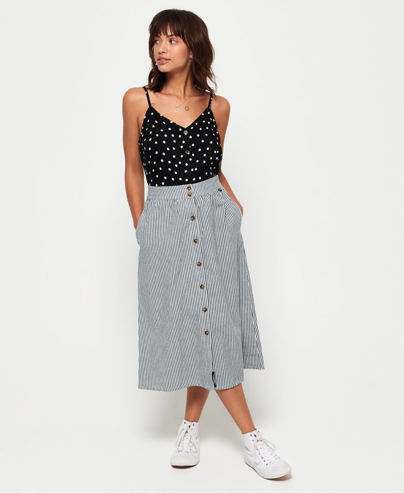 Superdry women's Mila midi skirt. Effortlessly versatile, the midi skirt is a must have in your wardrobe. The Mila midi features a button front, pockets in the side seams and has been crafted from a cotton/ linen blend for your comfort. The skirt is completed with logo tabs on the front and back of the waistband. Style with a knotted t-shirt and sandals for a look that will work all season.