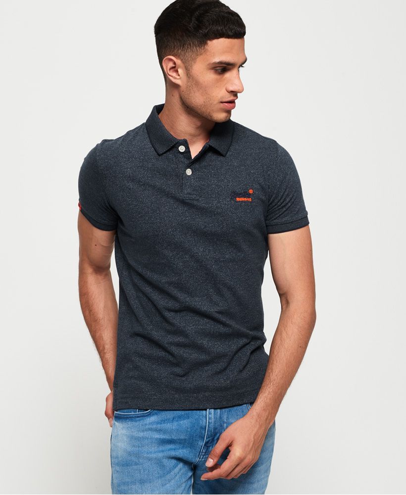 Superdry men's jersey polo shirt from the Orange Label range. This lightweight, cotton polo shirt features a two button fastening, split side seams and an embroidered version of the Superdry logo on the chest. The jersey polo is completed with a logo tab on one sleeve and on the hem.Slim fit