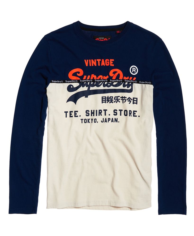 Superdry men's Shirt Shop split panel t-shirt. This long sleeve t-shirt features a panel design with logo taping across the chest, a crew neck and large logo graphic on the front. Style with jeans and trainers for a relaxed yet stylish look.
