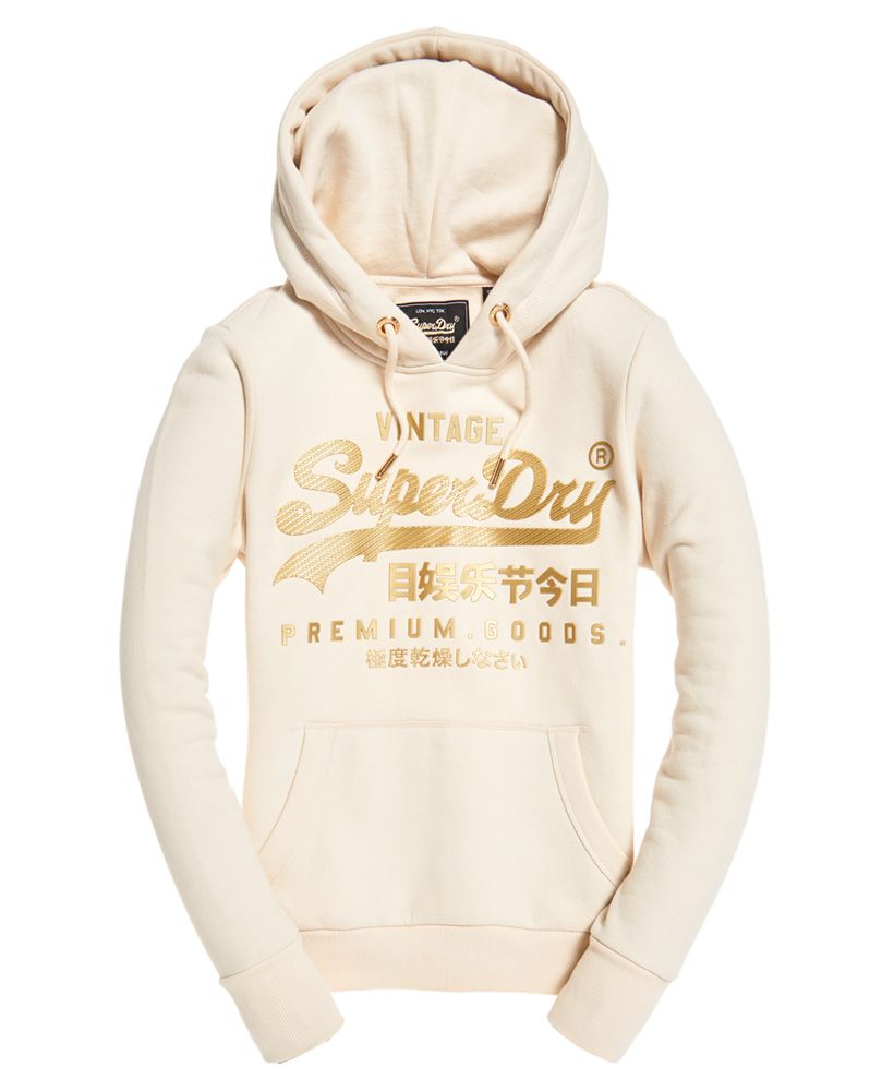 Superdry women's Vintage Logo premium luxe hoodie. A classic style overhead hoodie featuring a drawstring hood, soft lining, a large pouch pocket and ribbed cuffs and hem. Finished with a large textured Superdry logo across the front and a Superdry logo tab on the side seam.