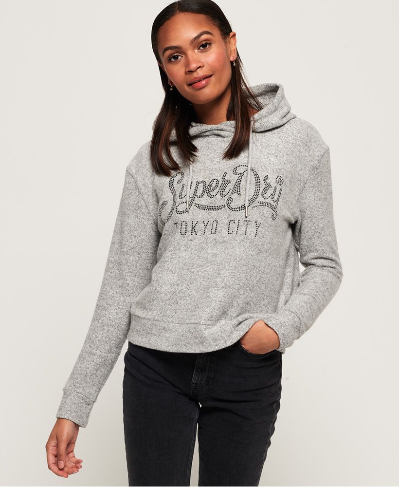 Superdry women’s Enford hood top. This super soft hooded top features a drawstring hood and an embellished Superdry logo across the chest. This top has been finished with a Superdry logo tab on the hem. Team this top with your favourite jeans this season.