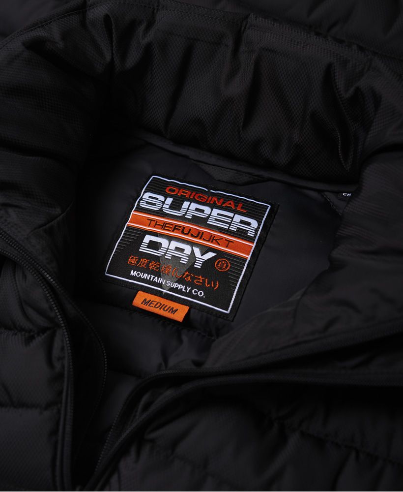 Superdry men’s Fuji double zip jacket. A perfect accompaniment to any wardrobe, the Fuji jacket is a modern classic and will take you right through the the cooler months. This quilted jacket features a double collar and twin-layer zip fastening, two front zip fastened pockets and one internal pocket with a snap fastener. The Fuji double zip jacket is completed with a rubber Superdry logo badge on the right sleeve. If you need extra warmth, layer up with sweat or hoodie for off duty style or a classic piece of knitwear for a more formal look.