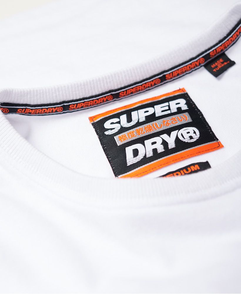 Superdry men's International long sleeve t-shirt. Crafted from a soft cotton for your everyday comfort, this long sleeve t-shirt features a crew neck, logo badge on the chest and is completed with a logo tab on the hem. Pair with slim jeans and trainers for an easy everyday look.