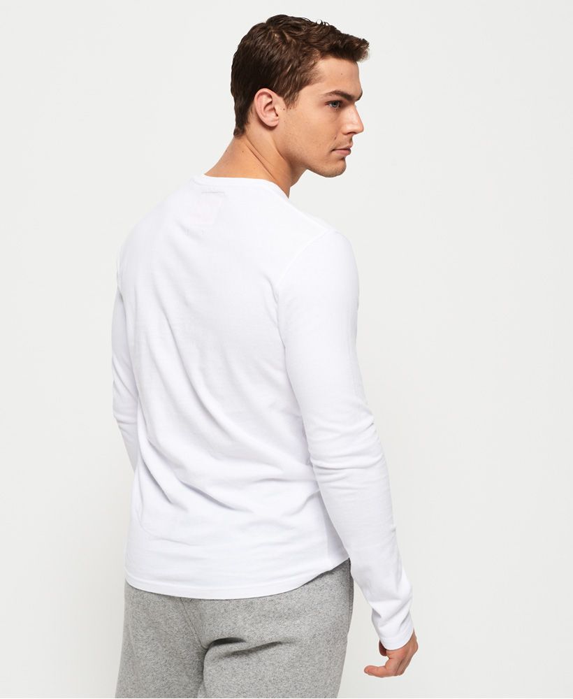 Superdry men's International long sleeve t-shirt. Crafted from a soft cotton for your everyday comfort, this long sleeve t-shirt features a crew neck, logo badge on the chest and is completed with a logo tab on the hem. Pair with slim jeans and trainers for an easy everyday look.
