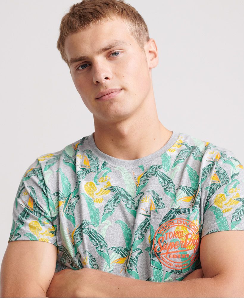Superdry AOP Pocket Lite T-Shirt. This short sleeved all over print lightweight T-Shirt features a ribbed neckline, single breast pocket with embossed Superdry logo. Perfect for livening up that wardrobe.