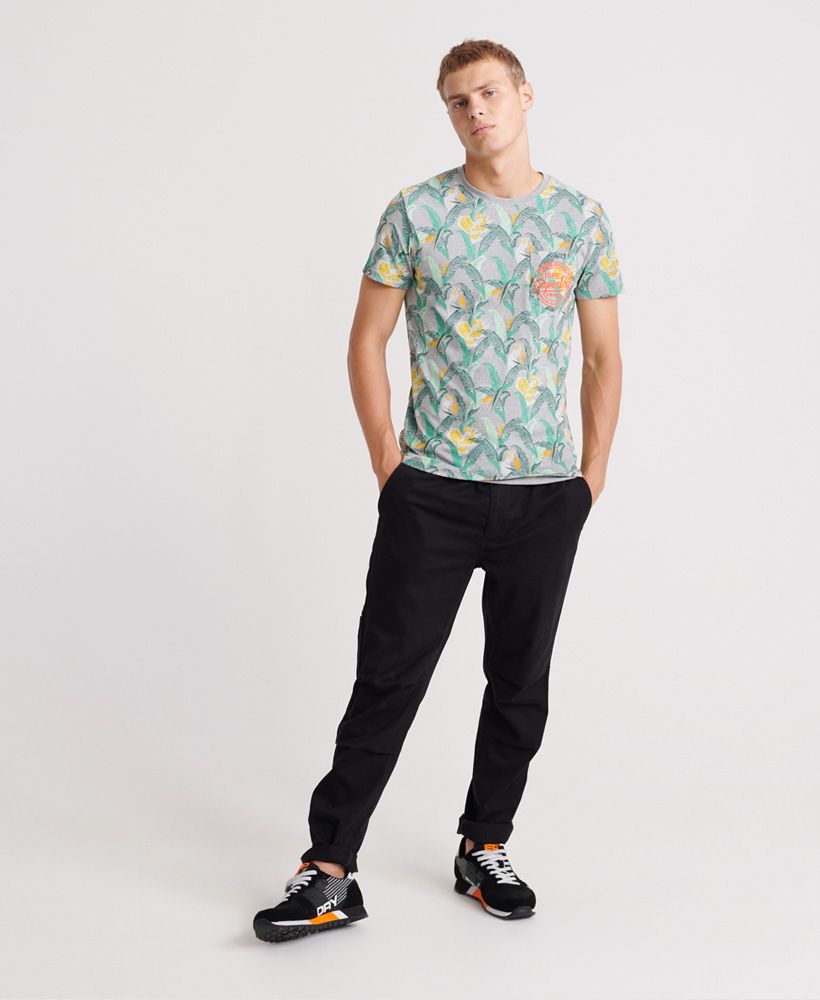 Superdry AOP Pocket Lite T-Shirt. This short sleeved all over print lightweight T-Shirt features a ribbed neckline, single breast pocket with embossed Superdry logo. Perfect for livening up that wardrobe.