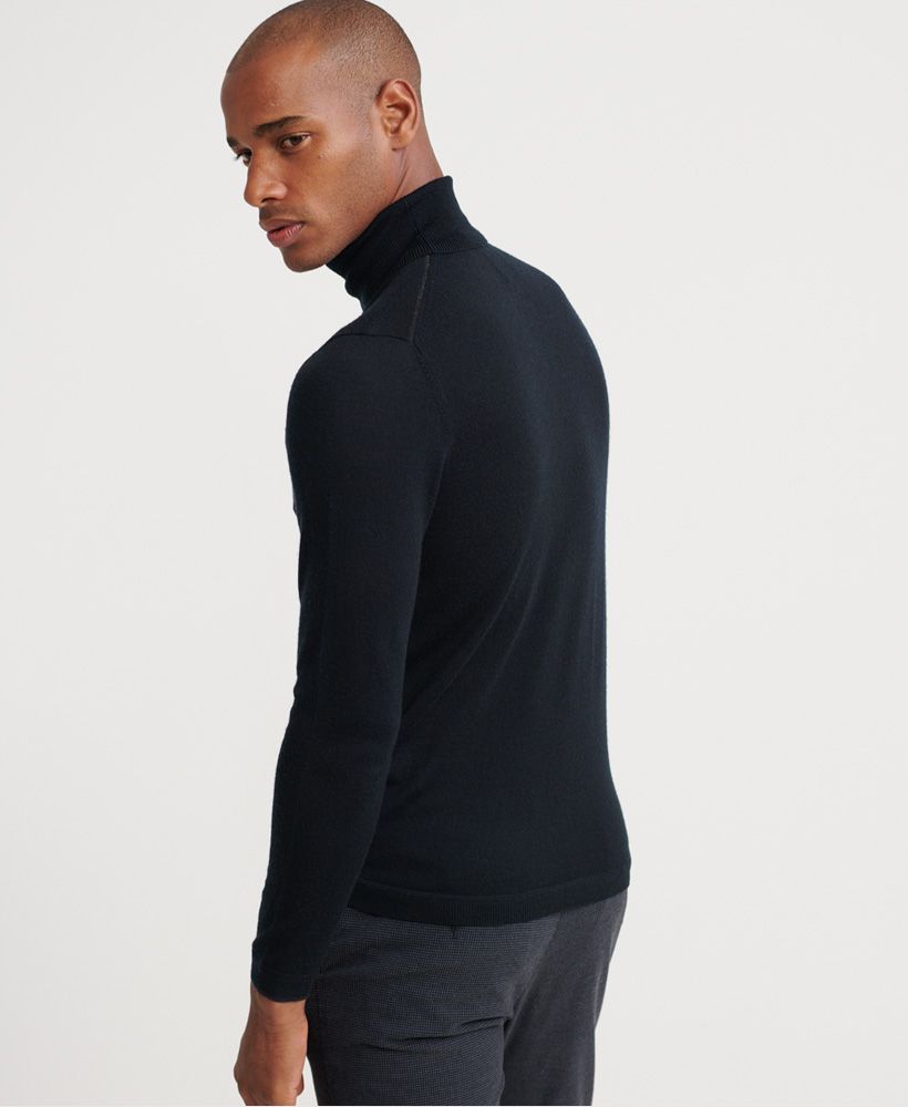 Superdry men's Edit Merino Roll Neck jumper. A must have this season. This light weight jumper features a roll neck, ribbed cuffs and hem. Finished with a Superdry logo badge on the sleeve. Pair with slim fit jeans for a sophisticated, classy look.