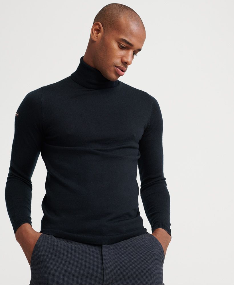 Superdry men's Edit Merino Roll Neck jumper. A must have this season. This light weight jumper features a roll neck, ribbed cuffs and hem. Finished with a Superdry logo badge on the sleeve. Pair with slim fit jeans for a sophisticated, classy look.