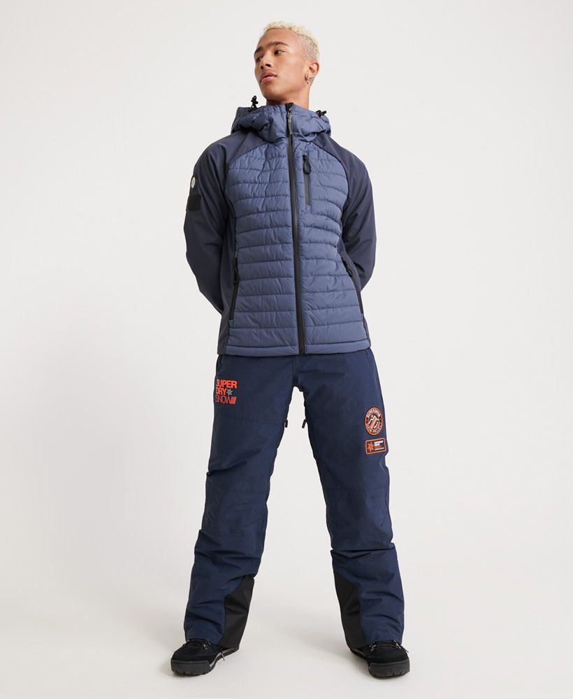 Superdry men’s Mountain Snow pants. These pants are a must-have on the slopes this season. Featuring a zip and popper fastening, hook and loop waist adjuster straps and thigh vents to keep you comfortable. These pant also feature zipped hems with boot gaiters. For practicality, these snow pants features two front zip pockets and two back pockets with popper fastenings. The Mountain snow pants are finished with branded zip pulls and poppers, a Superdry Snow logo on the upper thigh and two Superdry snow badges above the knee.Water resistant <10,000mmWind resistant <10,000g