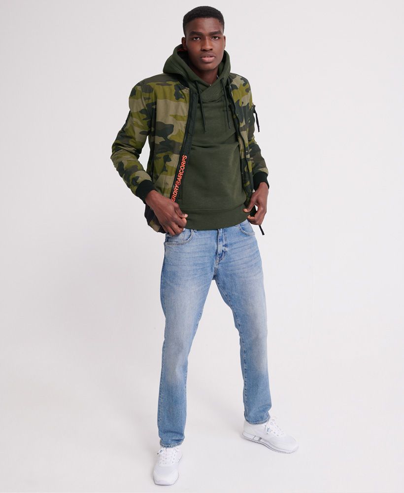 Superdry men's Urban Athletic overhead hoodie. This hoodie features a drawstring hood, ribbed cuffs with thumbholes, ribbed hem and a rubber Superdry logo on the chest. Completed with a front pouch pocket with two zip fastenings and a super soft lining, perfect for the cooler days.Slim fit