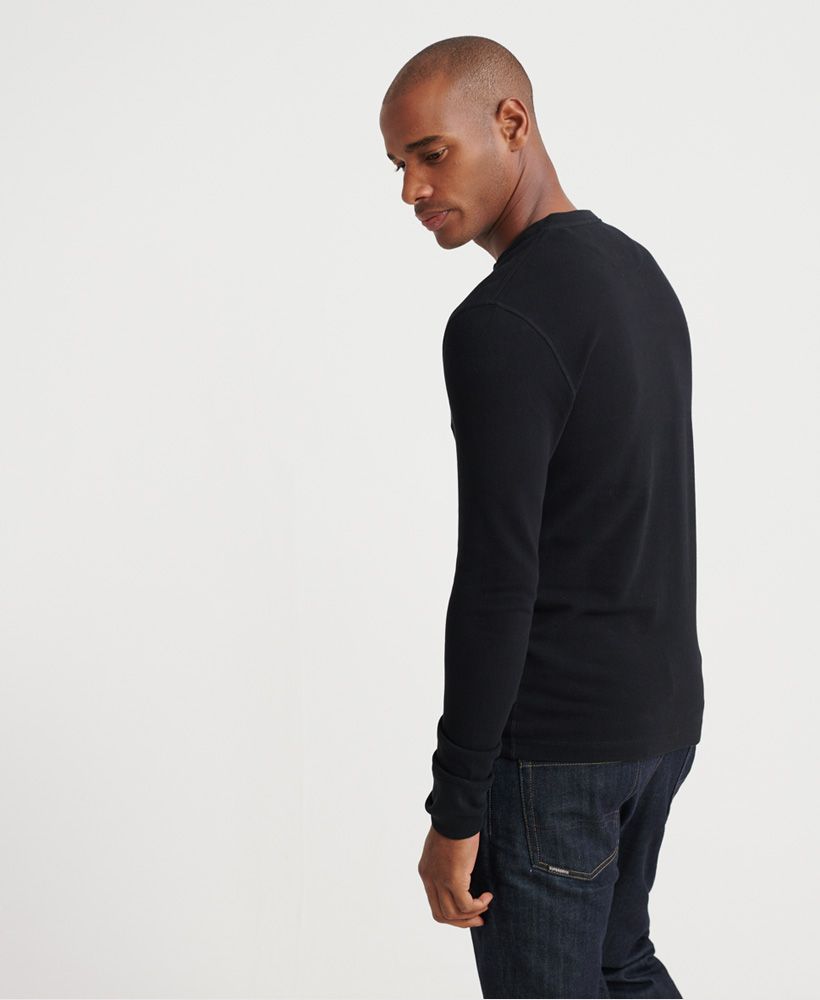 Superdry men's Edit long sleeved Henley top. This long sleeved top features a three button fastening and ribbed cuffs. Finished with a Superdry logo badge above the hem. Will look great paired with your favourite pair of jeans and a leather jacket this season.
