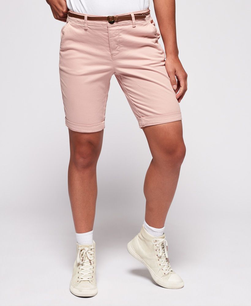 Superdry women's Chino City shorts. A seasonal spin on a classic pair of chinos, these belted chino city shorts feature a button fly fastening, four pockets and turn up hems. Completed with a metal logo badge above one front pocket and logo badge above one back pocket.