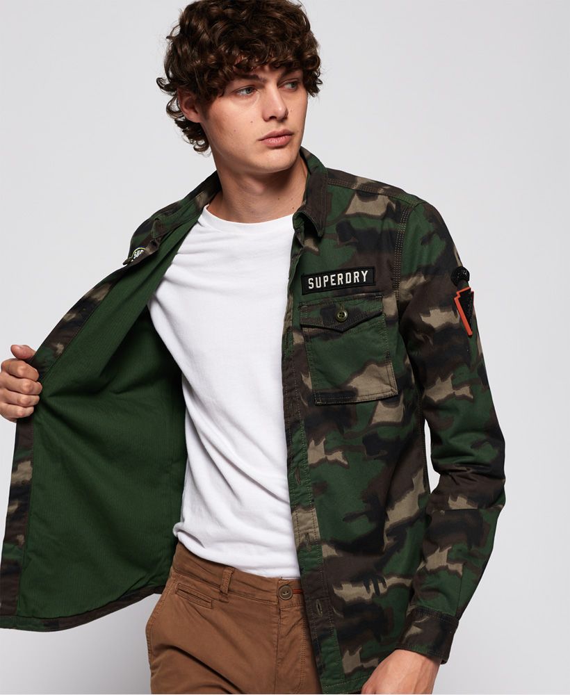 Superdry men’s Military Storm shirt. This military inspired long sleeve shirt features button fastening, twin chest pockets with button fastenings and button cuffs. This shirt is finished off with a variety of different badges on the sleeves and pocket.
