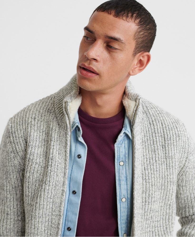 Superdry men's Downhill zip through cardigan. Update your knitwear this season with this cardigan, featuring a main zip fastening, a fleece lined collar and two pockets. Completed with a Superdry logo badge on one sleeve.