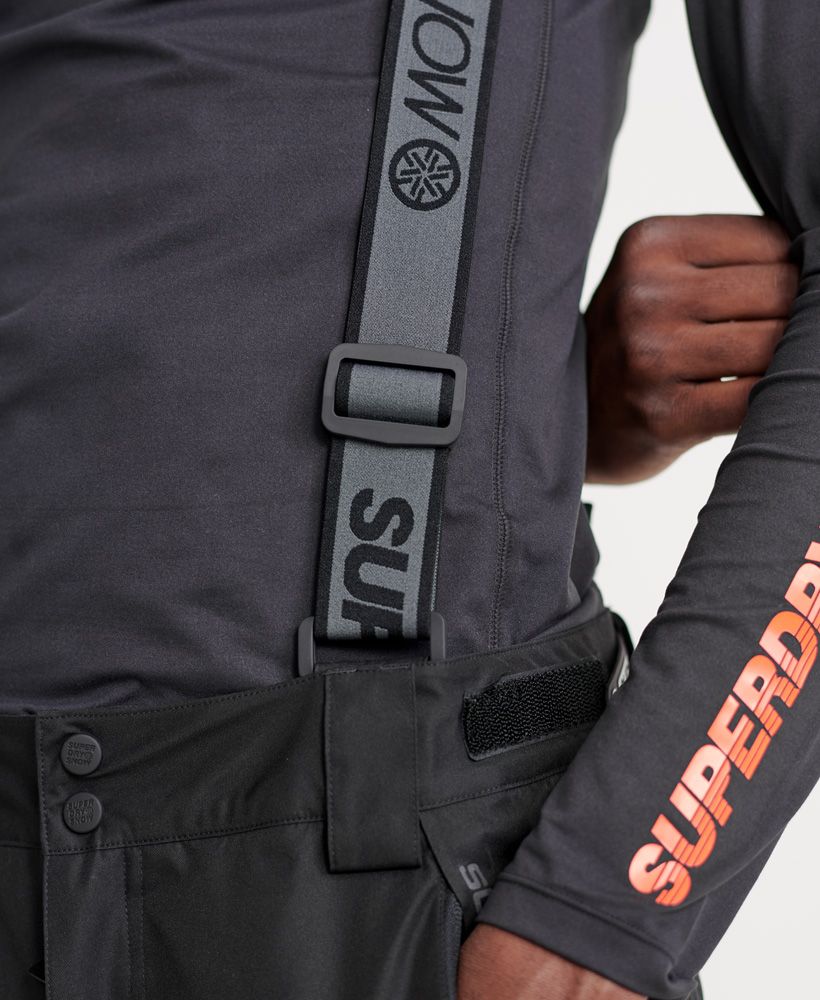Superdry men’s Snow Assassin pants. These pants are a must-have on the slopes this season. Featuring a zip and popper fastening, hook and loop waist adjuster straps and thigh vents to keep you comfortable. These pant also feature zipped hems with boot gaiters and detachable braces for an enhanced fit. For practicality, these snow pants features four front zip pockets and two back pockets with zip fastenings. The Snow Assassin pants are finished with branded zip pulls and poppers, a Superdry Snow logo on the upper thigh and two Superdry snow badges above the knee.The RECCO reflector in this product enables rescue professionals to locate you with RECCO detectors in the event of an avalanche accident or when lost in the outdoors.