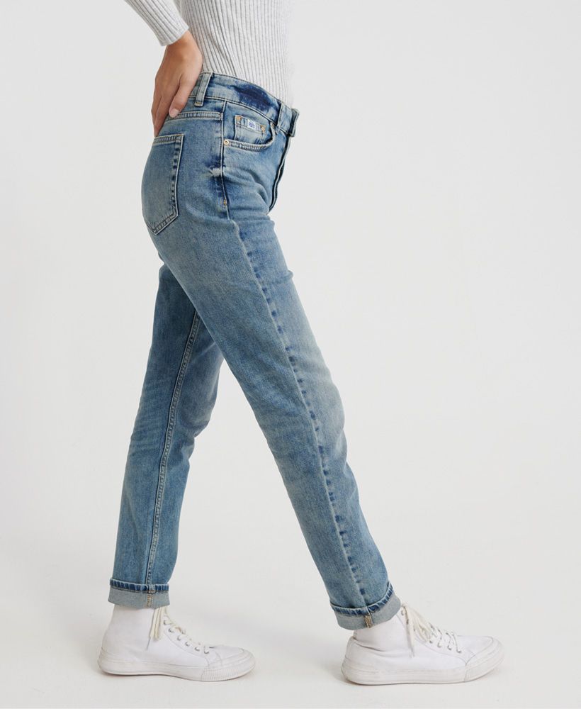 Superdry women's Harper boyfriend jeans. These denim jeans feature the classic five pockets including coin pocket, which are designed with a distressed seam to give it a rugged look. These jeans also feature a button fastening, belt loops, and are finished with a leather Superdry patch on the waistband and a Superdry logo patch on the coin purse.Straight Fit. Classic for a reason – the original fit that gives you extra room throughout without being baggy or too loose fitting. About as authentic as you get. 