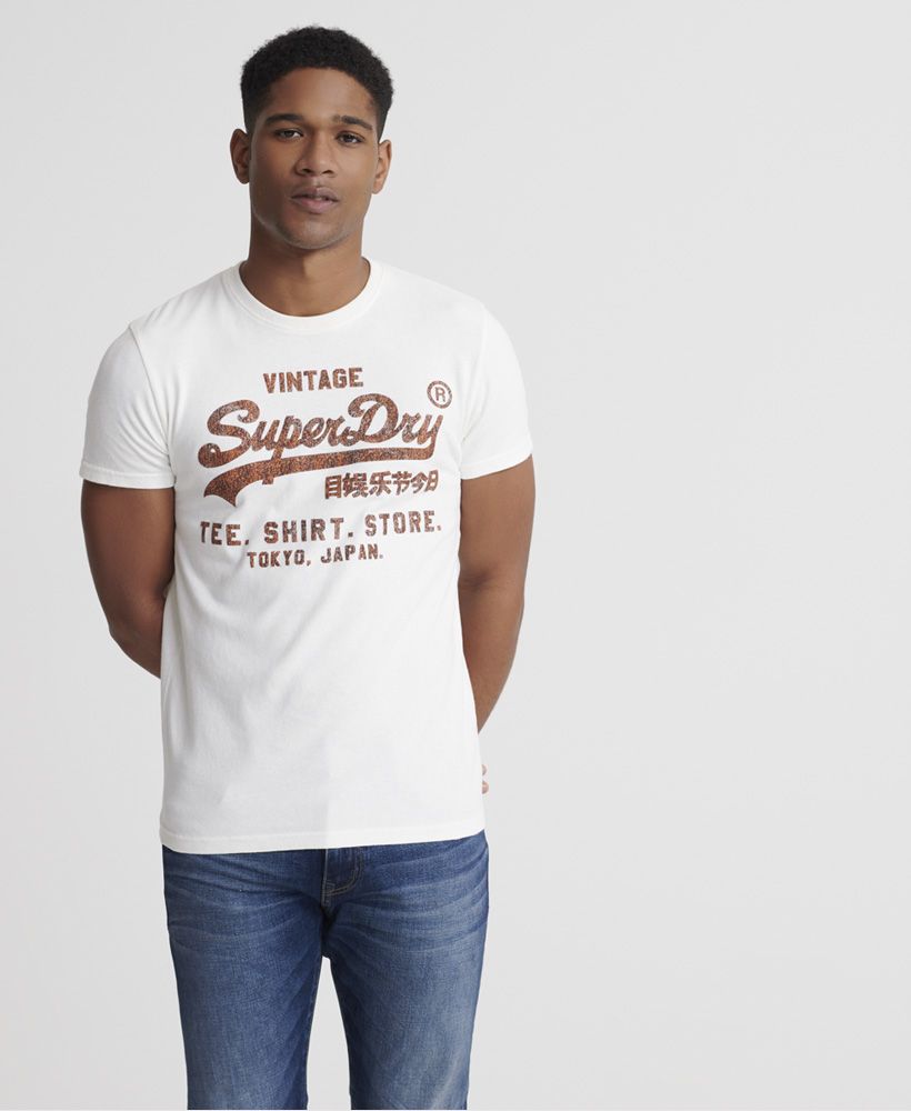 Superdry men's Vintage Logo Bonded T-Shirt. Part of our Shirt Shop range this classic Superdry tee features, a ribbed crew neck collar and finished with a textured Superdry bonded Vintage logo on the chest.Slim fit – designed to fit closer to the body for a more tailored look