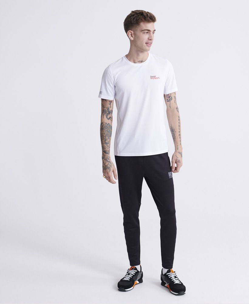 Superdry men's Training T-shirt. This short sleeve t-shirt features flatlock seams for your comfort, and is made with fabric designed to help keep you cool and dry, so you can train at your best for longer. Finished with reflective Superdry logos on the chest, sleeve, and back.Relaxed: A classic fit. Not too slim, not too tight – no distractions here
