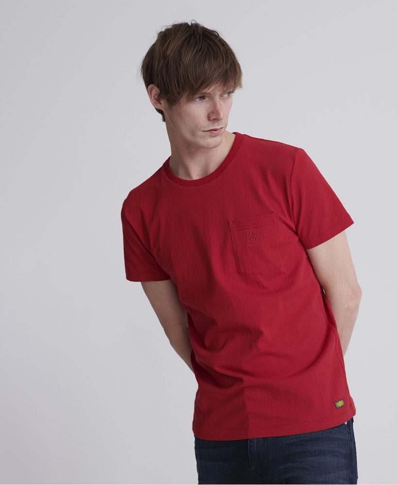 Superdry men's Denim Goods Co pocket T-shirt. This versatile cotton T-shirt features a crew neckline, short sleeves, and a pocket on the chest. Finished with an embroidered Superdry logo on the pocket and a Superdry logo patch on the hem.Slim fit