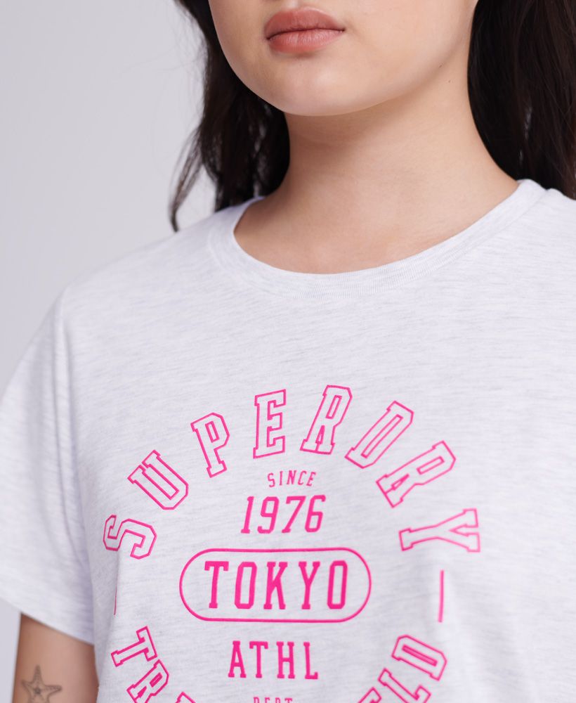 Superdry women's Track & Field T-shirt. Update your athleisure collection this season, this tee features a short sleeve design and a soft cotton blend fabric. Finished with a Superdry Track and Field logo on the chest.Slim fit