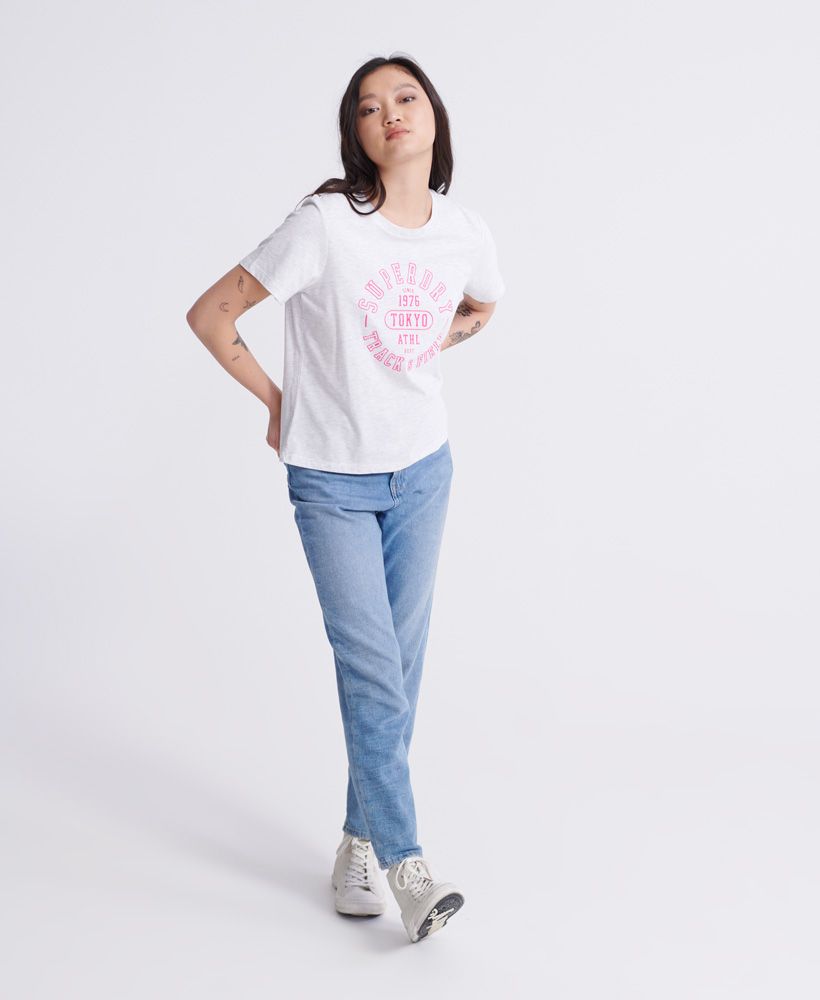 Superdry women's Track & Field T-shirt. Update your athleisure collection this season, this tee features a short sleeve design and a soft cotton blend fabric. Finished with a Superdry Track and Field logo on the chest.Slim fit