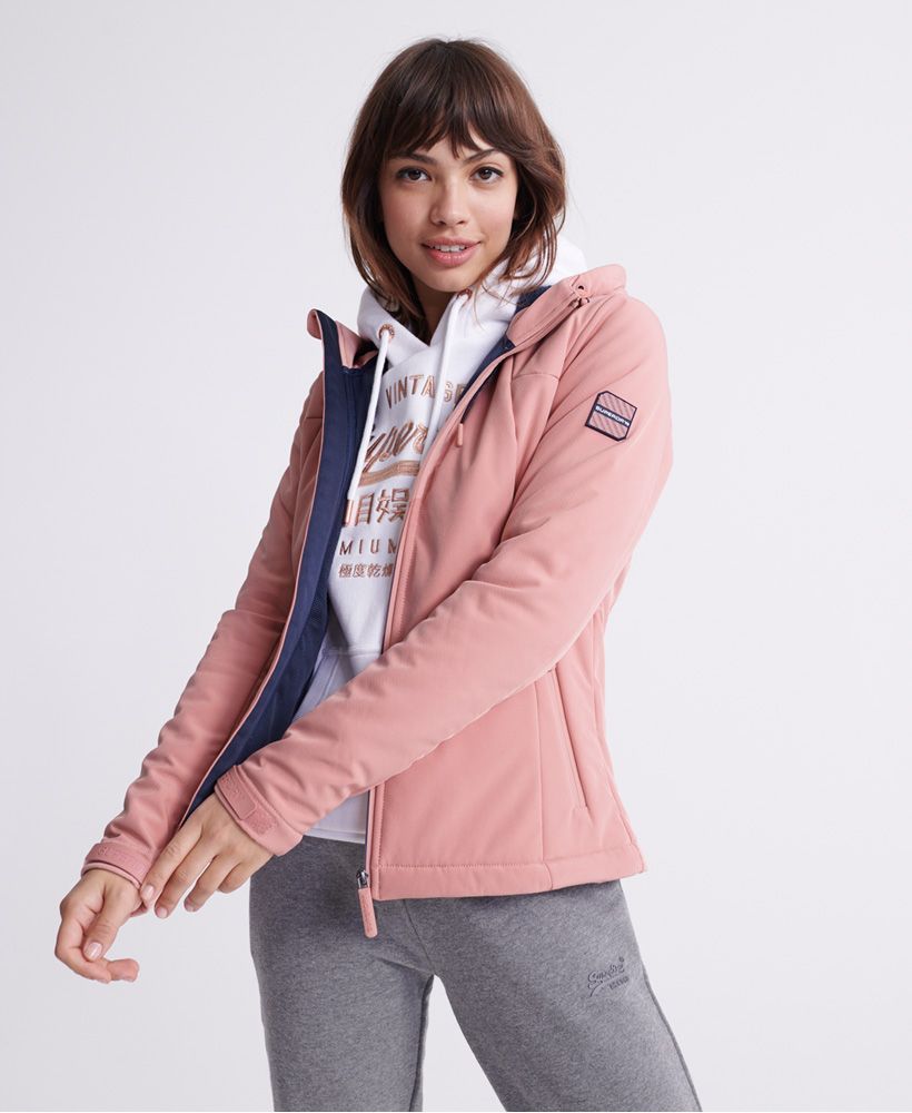Superdry women's Winter Ichigo SD- Windtrekker jacket. Part of our iconic Wind family and inspired by mountaineering gear, this jacket was designed to keep the cold at bay. Featuring hook and loop adjustable cuffs, two front zipped pockets, a part mesh part fleece lining, a main zip fastening, and a bungee cord adjustable hood with fleece lining. Completed with a textured Superdry logo on the back and a Superdry badge on one sleeve.