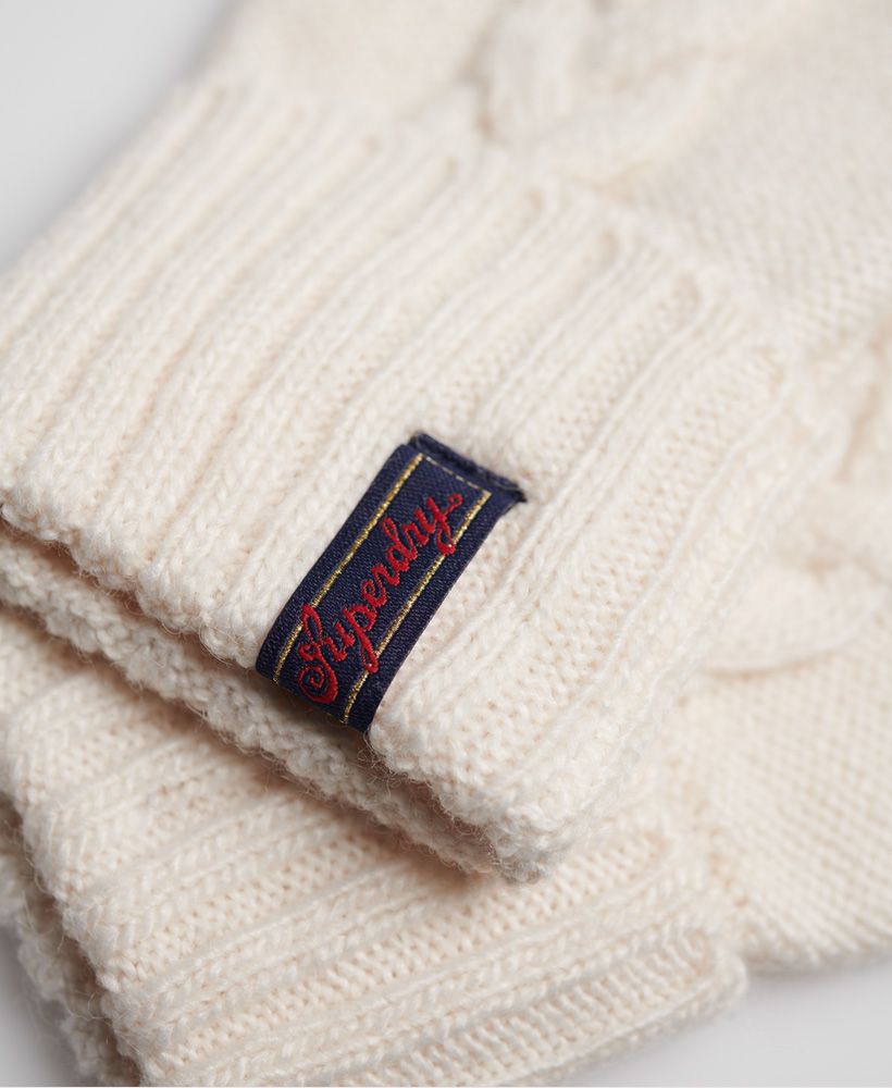 Superdry women's Lannah Cable Gloves. These Lannah cable gloves feature a subtle cable knit design and a roll up hem with a Superdry logo tab.